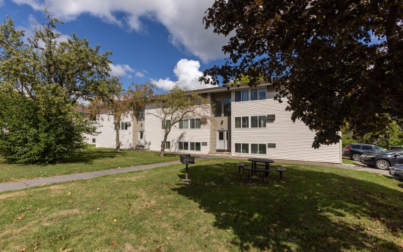 Lawn and apartment building at Brook Manor Apartments, Syracuse NY