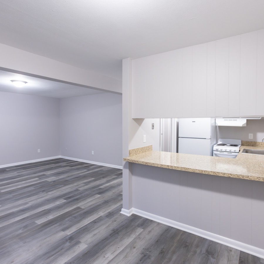 Open living area with a kitchen breakfast counter at Carriage House Apartments, Syracuse NY