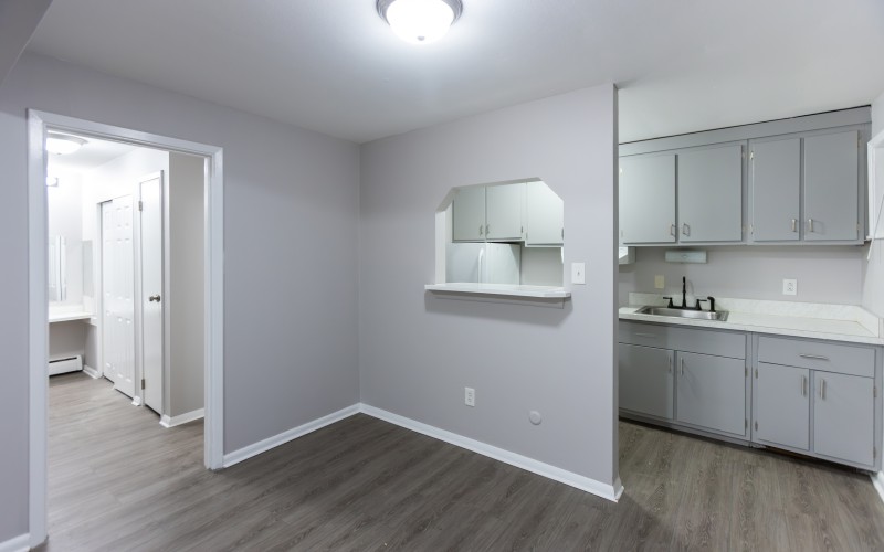 Studio main room with kitchen pass-through at Carriage House Apartments, Syracuse NY
