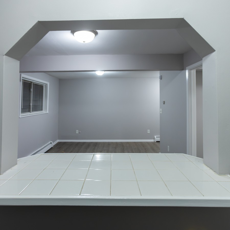 Studio kitchen pass-through looking into the living area at Carriage House Apartments, Syracuse NY