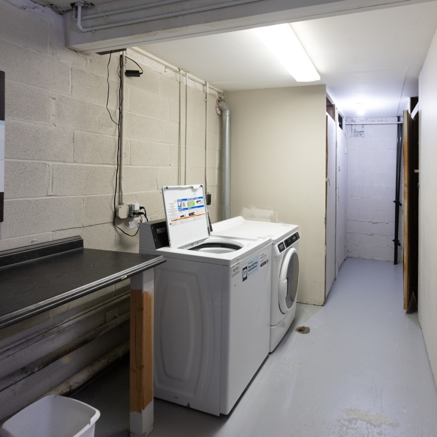 Laundry room with washer and dryer at Carriage House Apartments, Syracuse NY